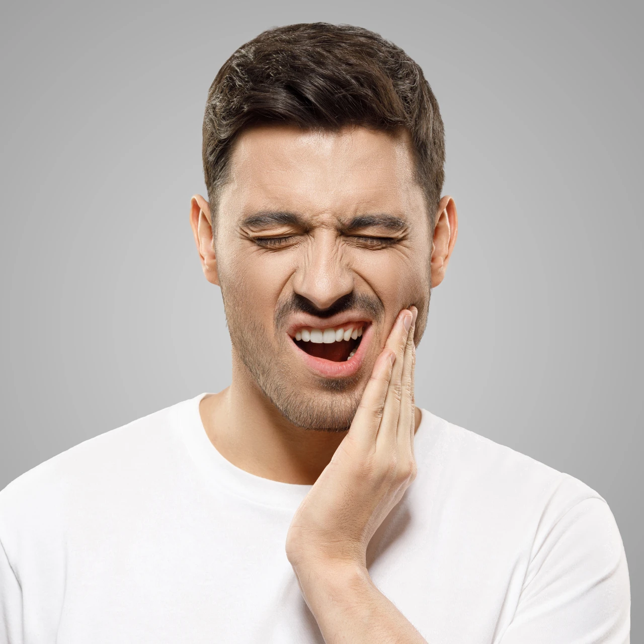 man with jaw pain needs tmj treatment